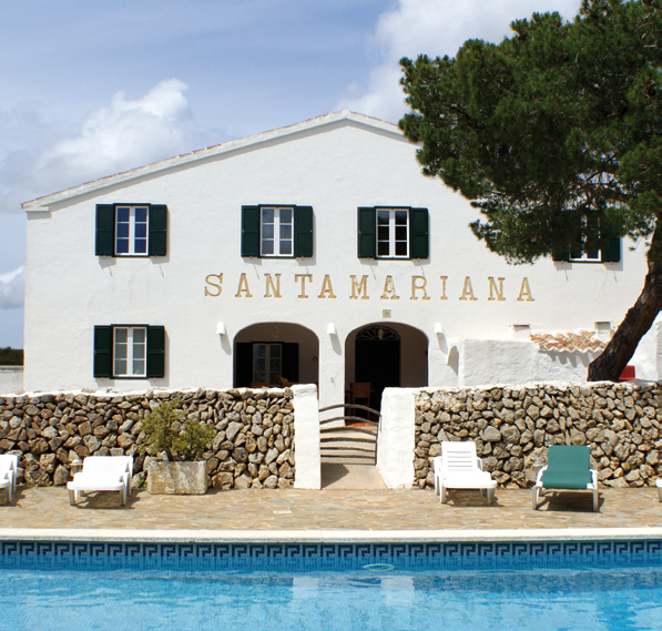 Farm landscape at Agroturism Santa Mariana, featuring traditional buildings and lush greenery.