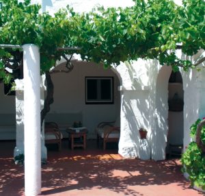 Rustic farm building at Agroturism Binisaid Menorca, offering an authentic rural experience.